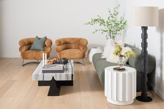 Modern living room with textured chairs and sofa.