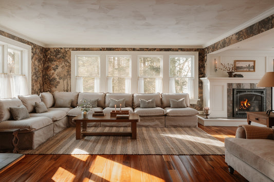 Cozy living room with sectional sofa and fireplace.